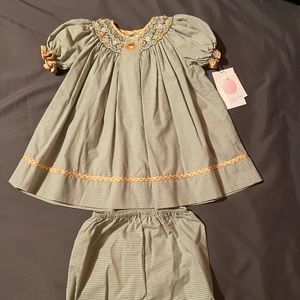 Smocked baby fall dress w undies. Green plaid w pumpkins and orange trim 9 mths